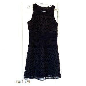 Navy shift dress. Hits just above the knee.